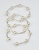 Bracciale elastico multi filo in perle e metallo